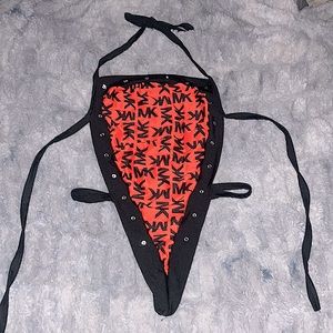 Michael Kor’s One-piece Exotic Dancewear Outfit